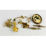 A group of 9ct jewellery pieces, comprising a swirl brooch set with three cultured pearls, a