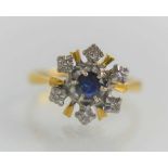 An 18ct gold sapphire and diamond ring, set with six diamonds and a single blue sapphire in a