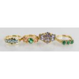 A 9ct gold and five stone topaz ring, a 9ct gold and amethyst cluster ring, and two 9ct gold rings