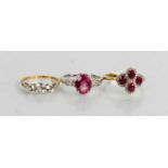 A 9ct white gold, pink sapphire and diamond ring, the oval sapphire flanked by two rows of