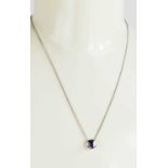 A 9ct white gold and sapphire pendant and chain necklace.