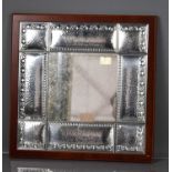A white metal Italian mirror, with hammered panels and embossed decoration, Fl Ag 3g 1137, 41 by