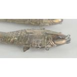 A pair of Chinese or possibly Indian white metal reticulated fish spice boxes, likely silver, each