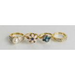 A 9ct gold, blue topaz and diamond ring, together with three 14ct gold rings, one set with opal