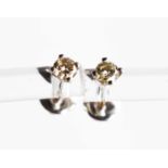 A pair of 9ct white gold and diamond earrings, brilliant cut, approximately 0.3cts in total, 0.93g.
