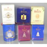 Six Bells old Scotch whiskey decanters with contents, Christmas and commemorative editions