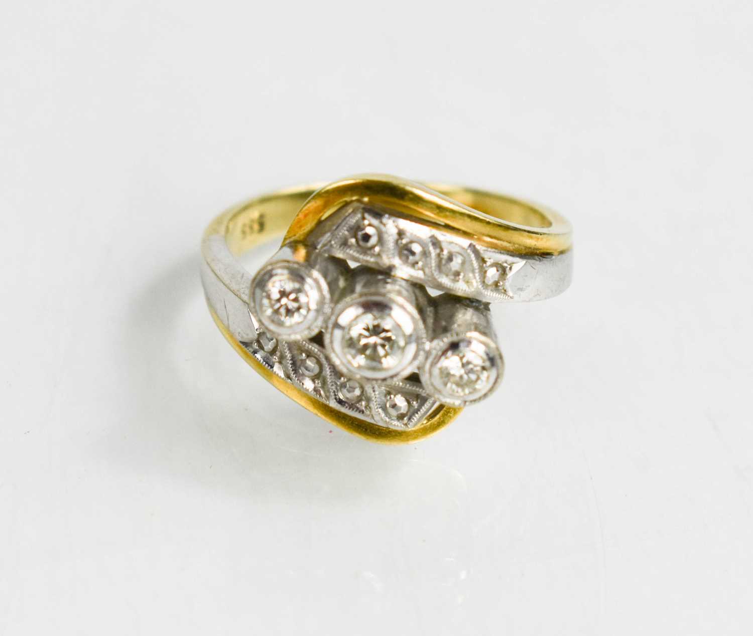 A 14ct gold, platinum and diamond ring, the three central diamonds in raised settings, 7.25g. - Bild 2 aus 3