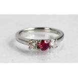 A platinum, pink sapphire and diamond trilogy ring, size K, 4.7g.