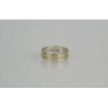 A 9ct white gold wedding band, 3.4g, size P 1/2.