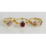 A 9ct gold, diamond and pink sapphire ring, size P/Q, and two further 9ct gold rings set with