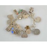 A silver charm bracelet with twenty charms, 1.6toz