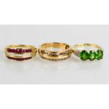 A 9ct gold, diamond and pink sapphire ring, a 9ct gold and green gemstone ring, and a 9ct gold and
