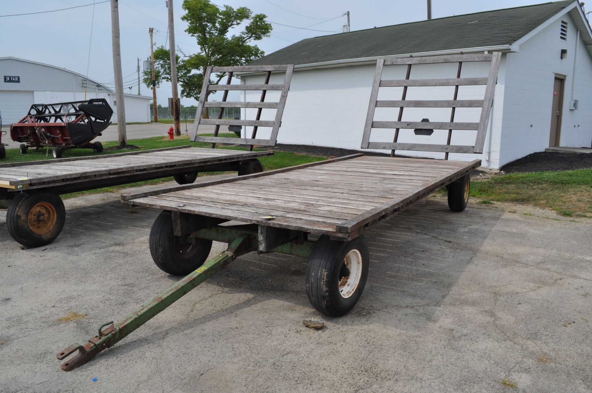 20’ Flat rack hay wagon, John Deere 1065 gear, 11L-15 tires, oak beds