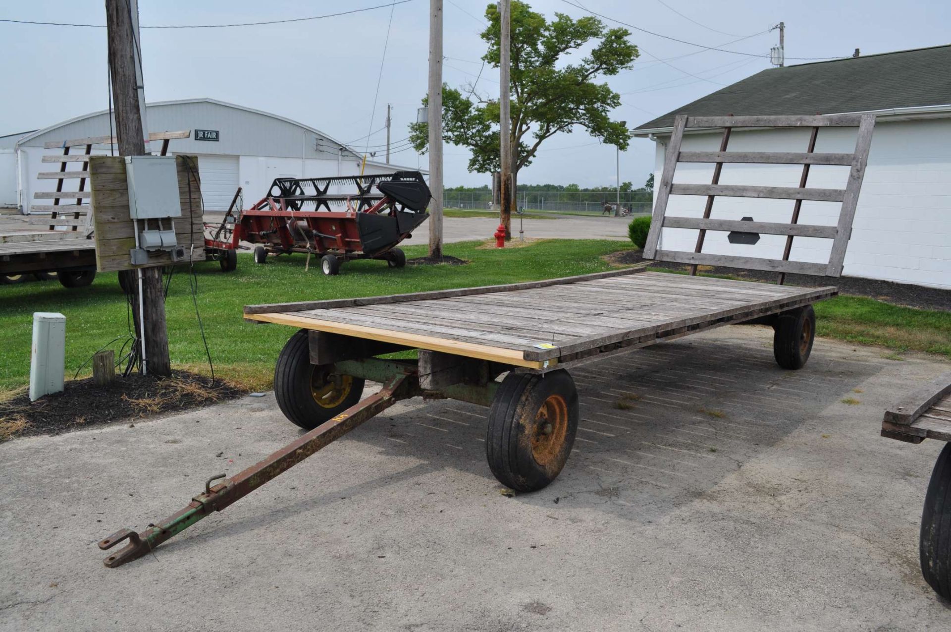 20’ Flat rack hay wagon, John Deere 1065 gear, 11L-15 tires, oak beds