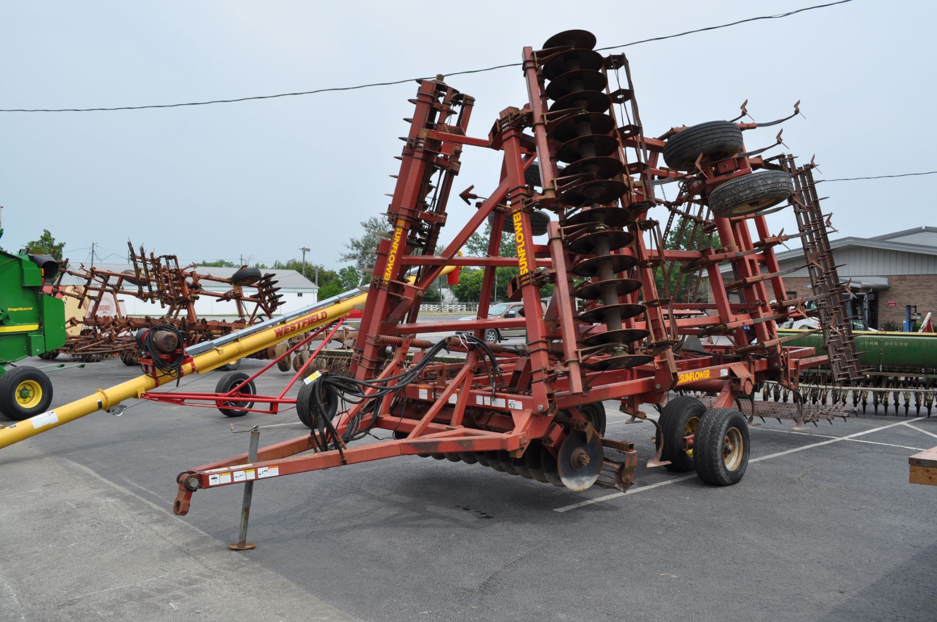 26' Sunflower 6332 soil finisher, front disk w/ reel, sweeps, 5 bar spike tooth harrow