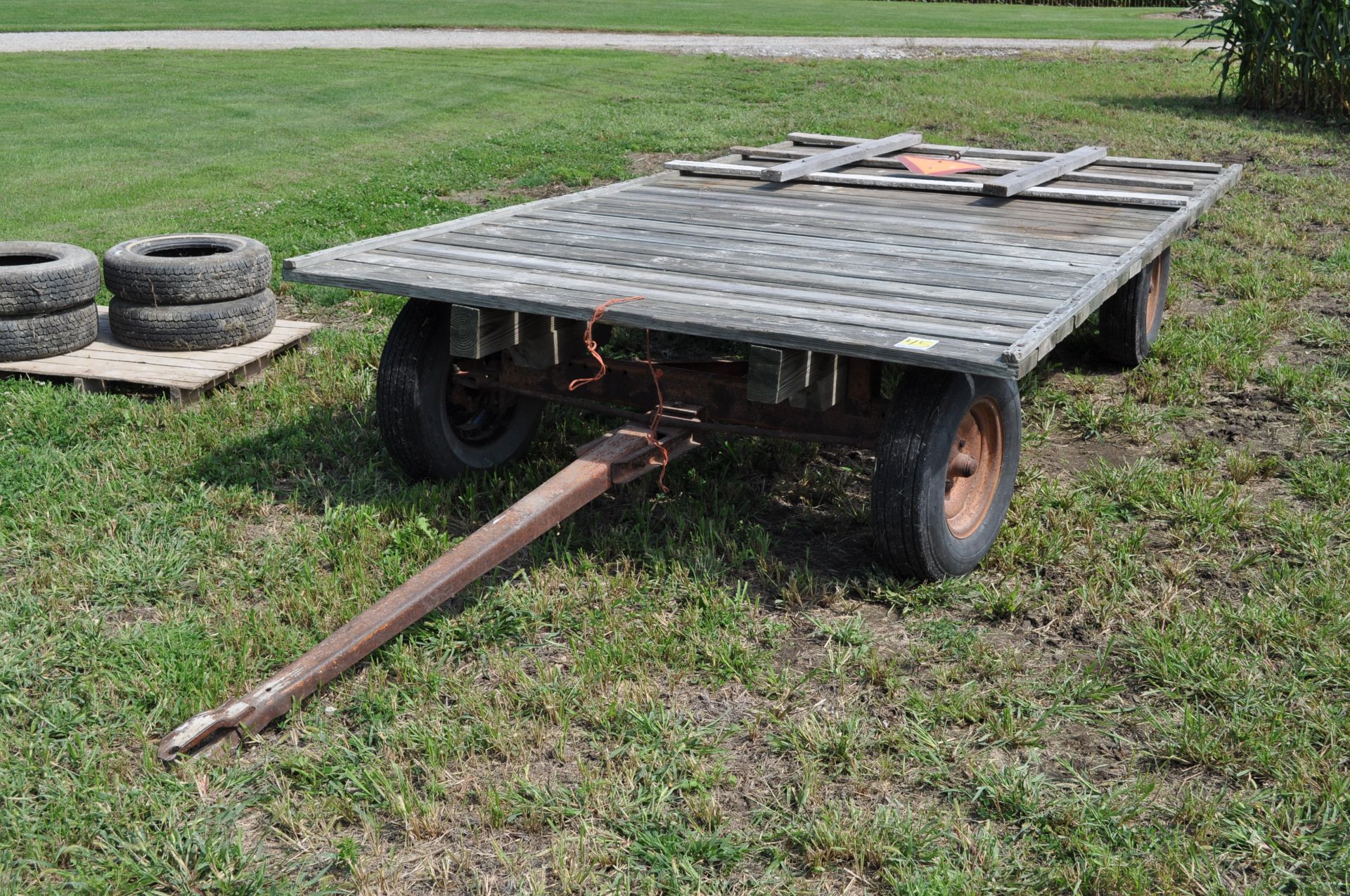 14’ x 7’ flat rack hay wagon, Montgomery Ward gear, 14” tires