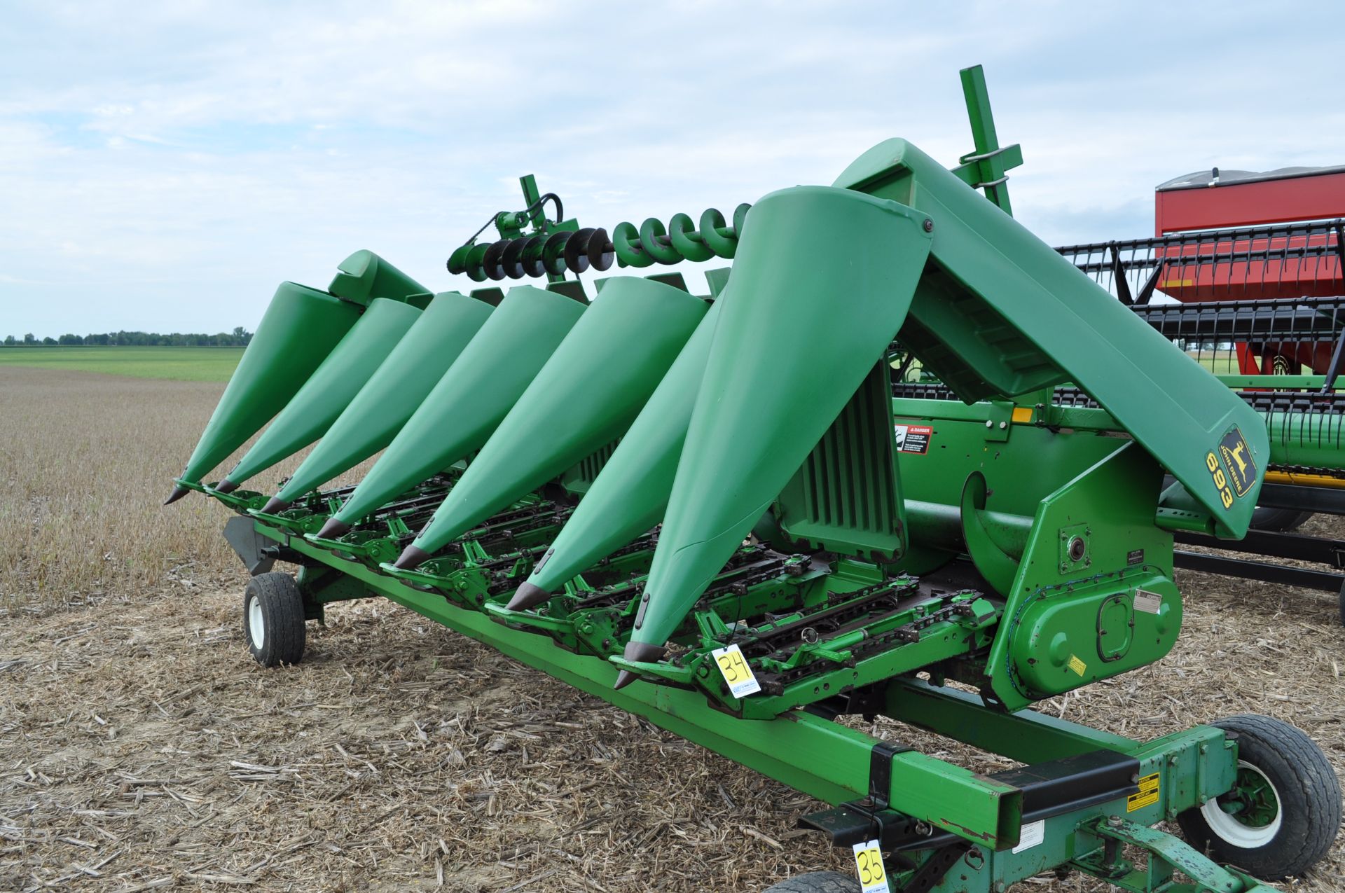 John Deere 693 corn head, 6 row x 30”, fluted rolls, poly, hyd drive fluff auger, Calmer stalk