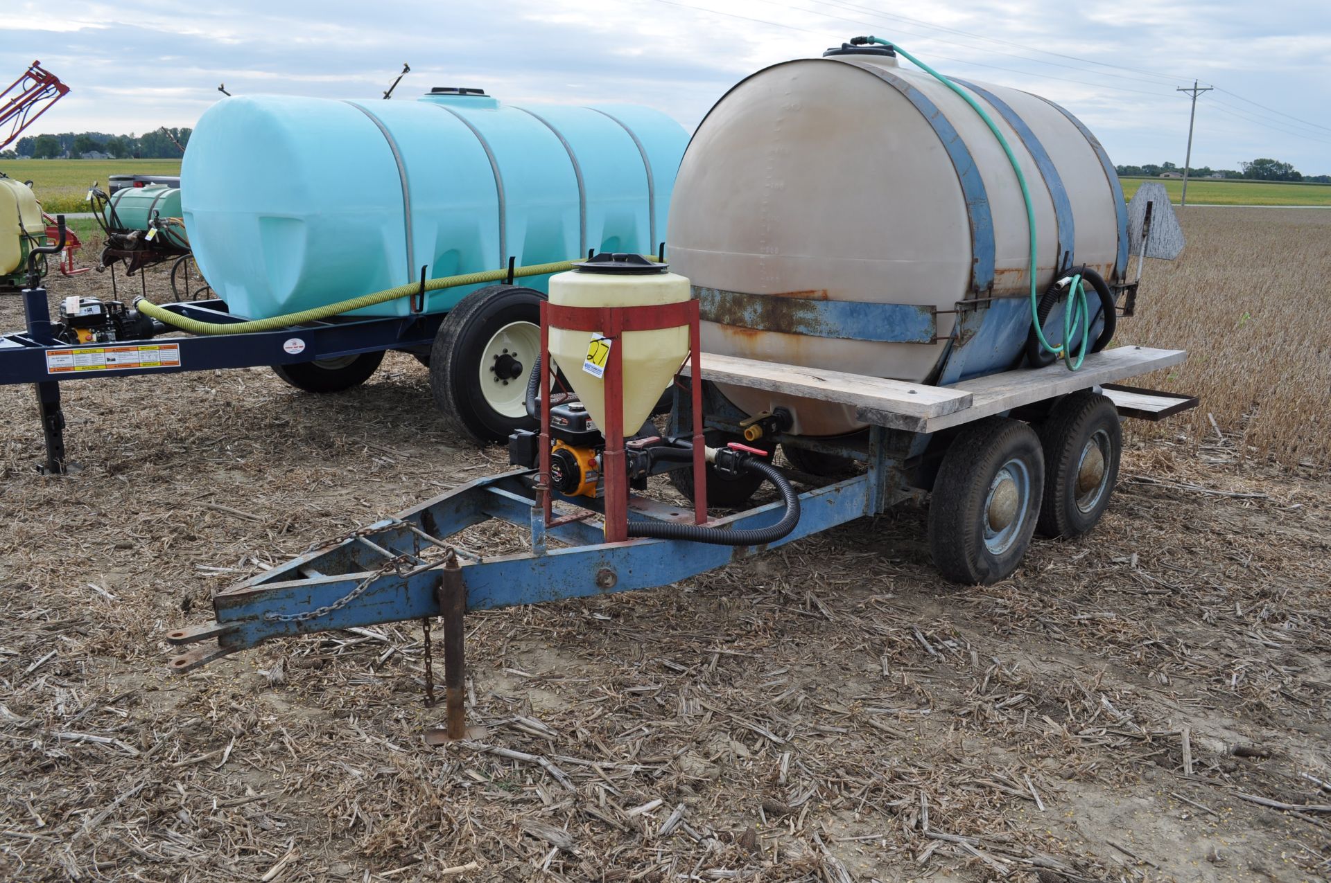 1000 gal shuttle trailer, 1000 gal poly tank, tandem axle, 2” Banjo poly pump, 15 gal inductor