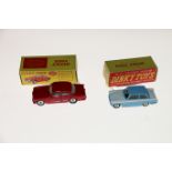 Two Dinky Toys diecast model vehicles; 184 Volvo 122S car with red body and spun hubs and 189