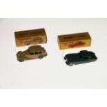 Two Dinky Toys diecast model vehicles; 151 Triumph 1800 Saloon car with fawn body and green hubs and