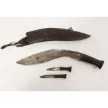 Nepalese Kukri knife in curved leather scabbard complete with two smaller blades.