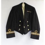 British Royal Navy dress uniform jacket having Gieves Ltd label "4/23 18/D8499 A R Hains", brass
