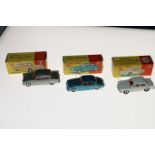 Three Dinky Toys diecast model vehicles; 144 Volkswagen 1500 with off-white body, red interior,