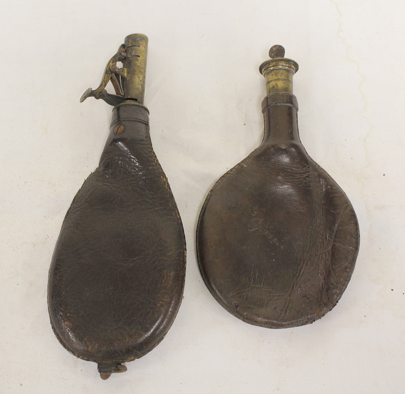 Two leather powder flasks with brass spouts, riding flask holder etc. (5). - Image 2 of 3