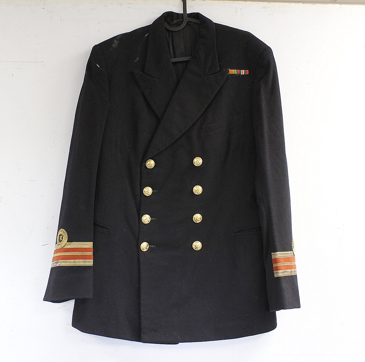 British Royal Navy dress uniform jacket having A & J Scott of Aberdeen interior label, brass naval