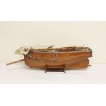 Small wooden model of a yacht.