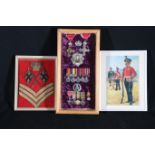 Grouped collection of medals within box frame including Crown badge and Royal Scots cap badge of