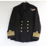 British Royal Navy dress uniform jacket having Gieves label, brass naval buttons by Gieves,