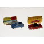 Two French Dinky Toys diecast model vehicles; 24M Karmann Ghia car with red body, black roof,