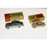 Two Dinky Toys diecast model vehicles; 195 Jaguar 3.4 Saloon car with cream body, red interior and