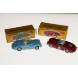 Dinky Toys diecast model vehicles 107 Sunbeam Alpine Sports car with deep pink body, grey