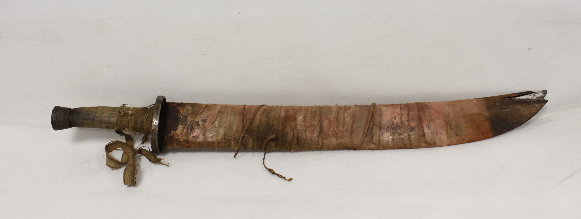 Antique Chinese Falchion type sword in cloth bound wooden scabbed. Inscription to blade, iron