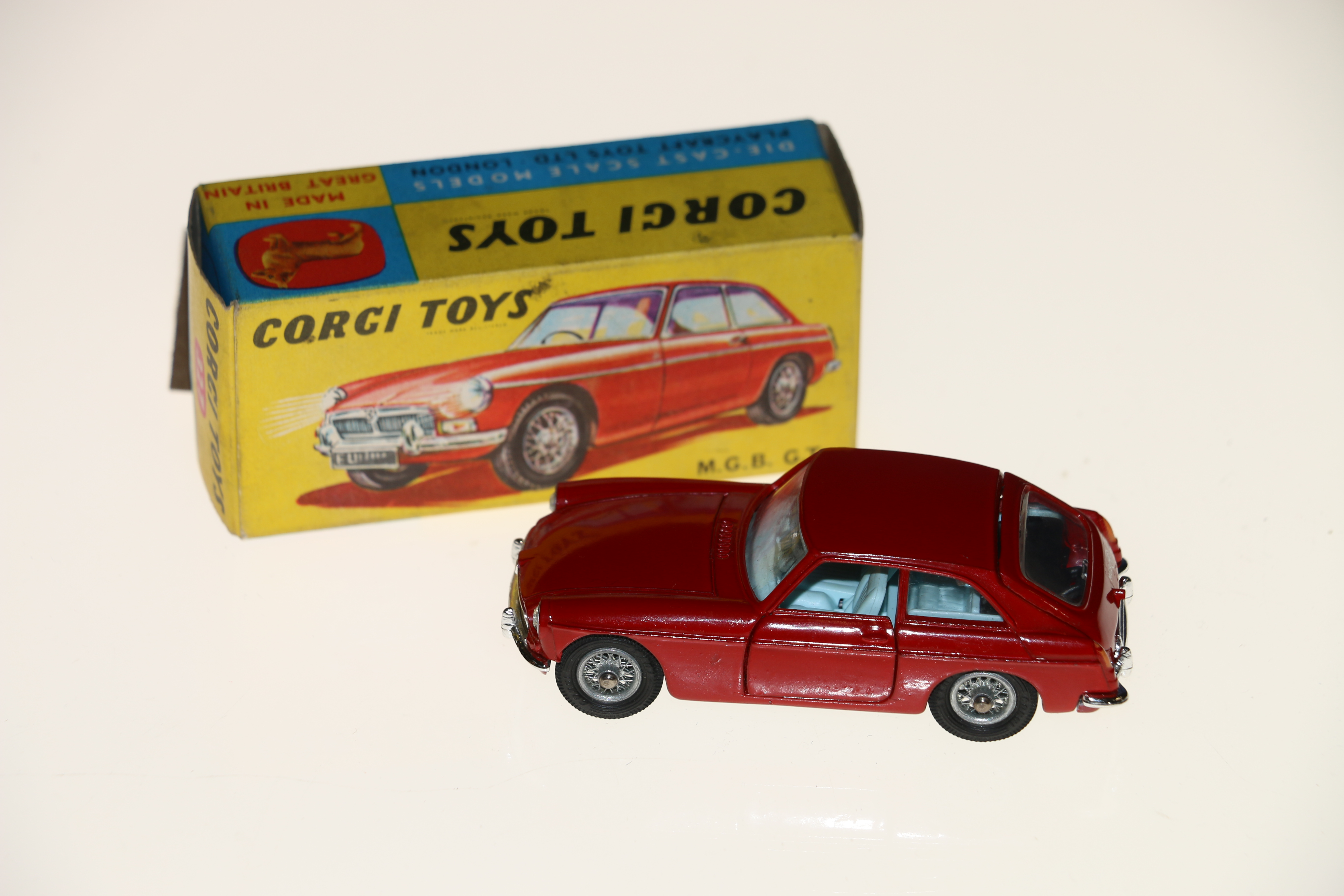 Corgi Toys diecast model vehicle 327 MGB GT with red body, light blue interior, spoked wheels and