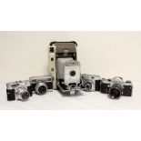 Five vintage cameras to include a 1950's Polaroid 800 land camera, Japanese Miranda SRL with a