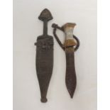 Two antique Sudanese arm knives both of leaf form and with original leather scabbards. The
