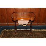 Early Victorian or Regency period sewing work table, the rectangular top with C scroll shaped ends