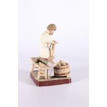 Russian Gardner style bisque porcelain figure of a man a child at the wash, red back stamp "by