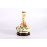 Japanese Satsuma vase of squat bottle shape, the body decorated with chrysanthemums, signed, 18cm,