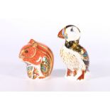 Two Royal Crown Derby bone china Imari palate paperweights in the form of a squirrel and a puffin