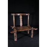 Senufo low tribal elder's chair with carved geometric decoration to the seat, and back slat, the