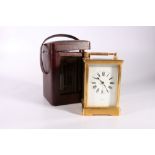 Edward of Glasgow brass carriage clock, 18cm tall with leather carrying case