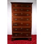 Victorian mahogany inlaid seven graduated drawer chest with Greek key cornice, raised on bracket