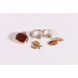 9ct gold buckle ring 1.9g, a 9ct gold cufflink 3.0g, an unhallmarked ruby and seed pearl ring 1.