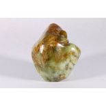 A Chinese hardstone boulder or scholar's stone in mottled green and brown hardstone, 15.5 cm x 14