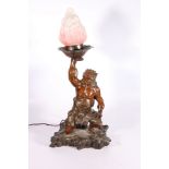 A Japanese bronze model of an oni, holding aloft a frosted pink and white flame lantern, fitted