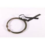 Antique heavy bronze circular ring with twisted ends to secure, possibly African, 15cm.